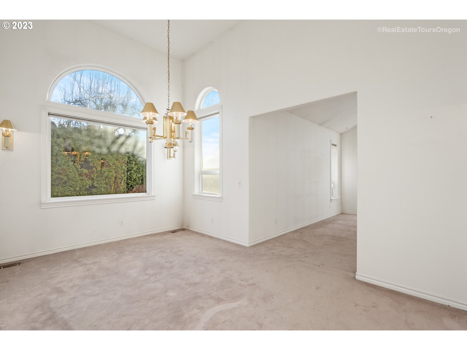 5161 Southeast Powell Valley Road Gresham, OR 97080 - Photo 12 of 32 a view of empty room with window and chandelier