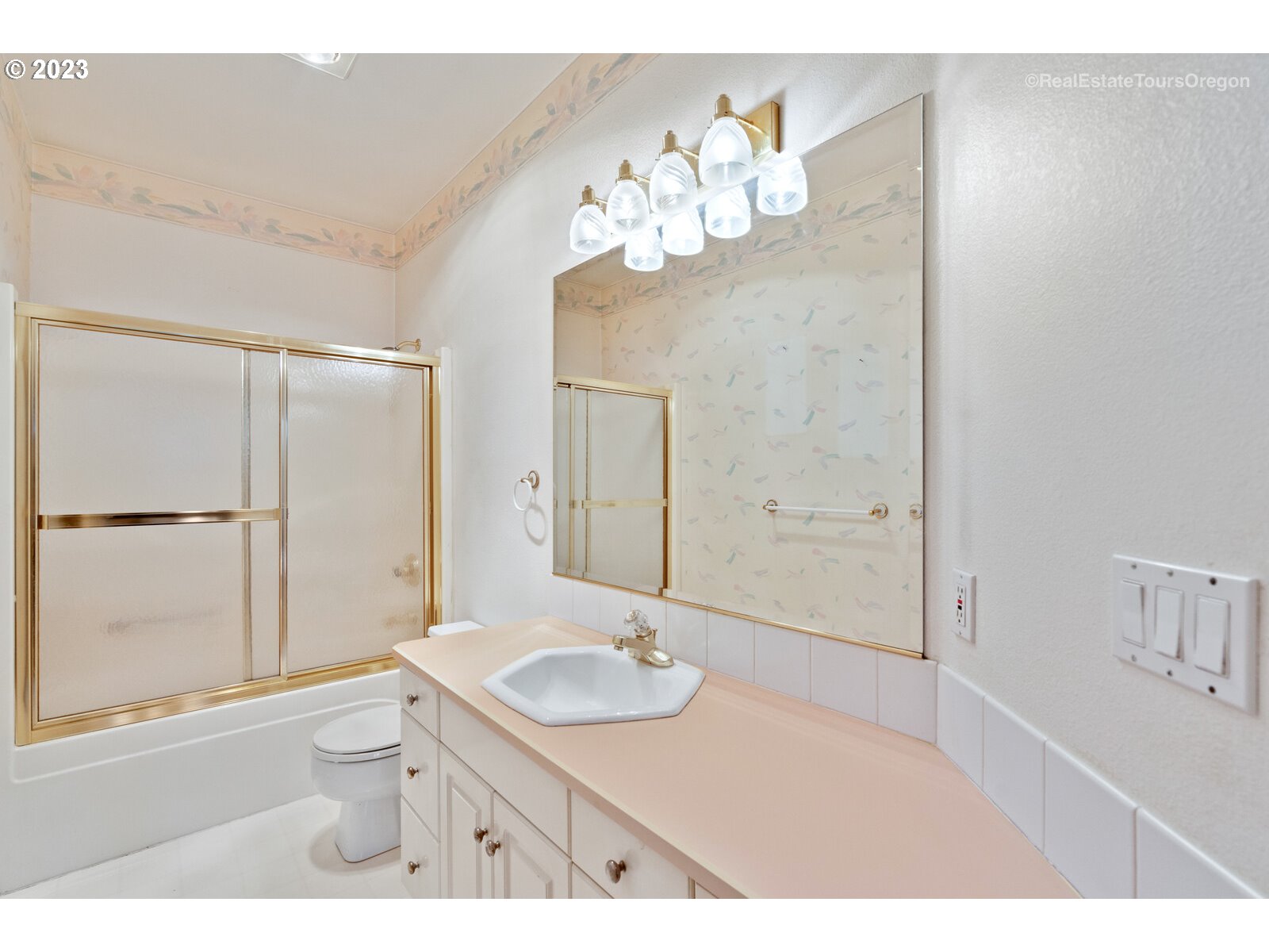5161 Southeast Powell Valley Road Gresham, OR 97080 - Photo 21 of 32 a bathroom with a sink a mirror and a shower