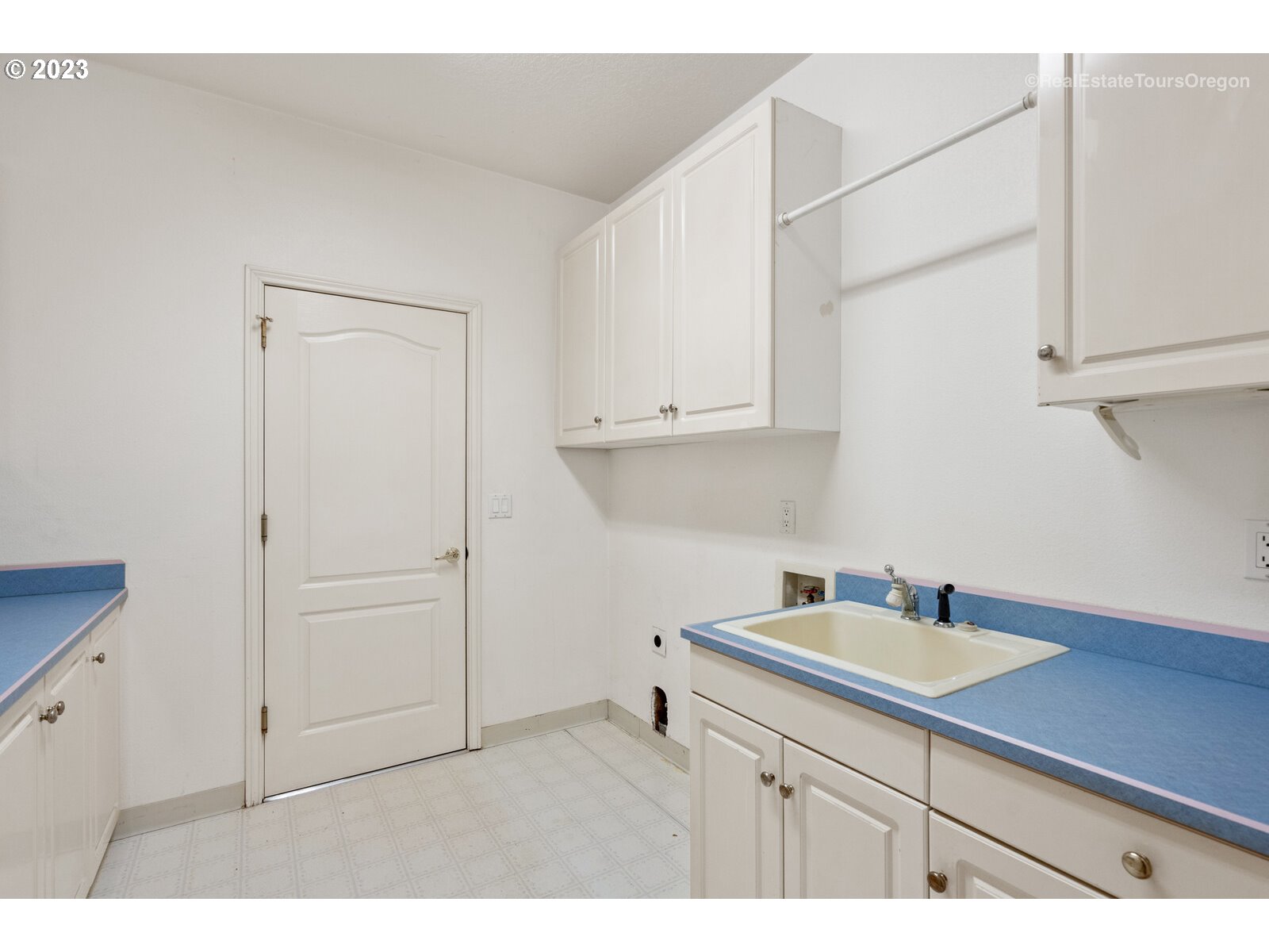 5161 Southeast Powell Valley Road Gresham, OR 97080 - Photo 22 of 32 a kitchen with a sink cabinets and a white counter top
