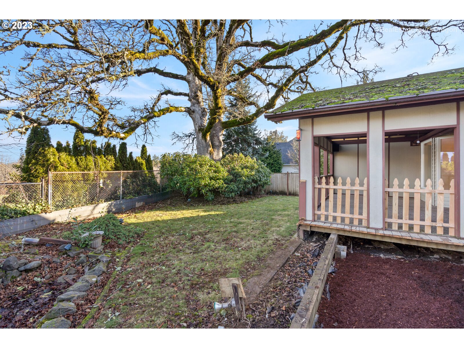 5161 Southeast Powell Valley Road Gresham, OR 97080 - Photo 24 of 32 a view of a backyard with wooden fence