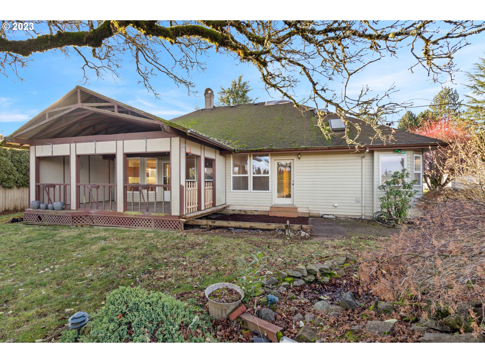 5161 Southeast Powell Valley Road Gresham, OR 97080 - Photo 25 of 32 a backyard of a house with yard table and chairs