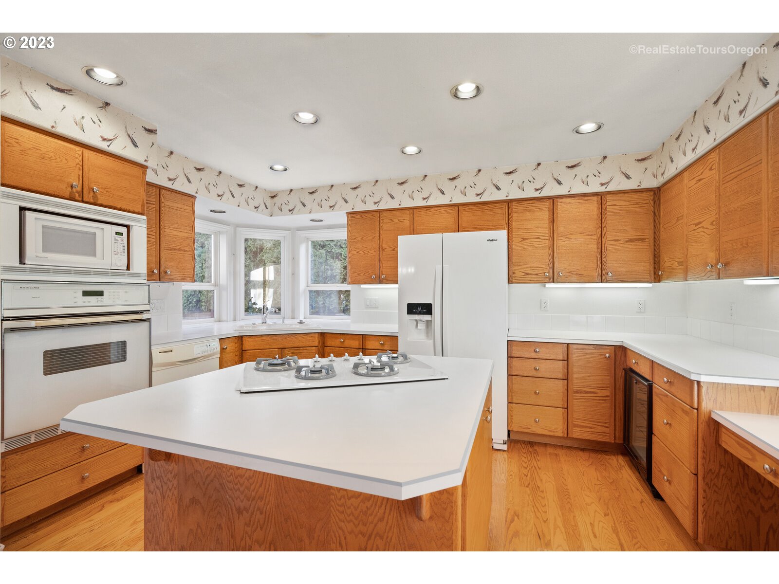 5161 Southeast Powell Valley Road Gresham, OR 97080 - Photo 3 of 32 a kitchen with stainless steel appliances granite countertop a sink and a stove