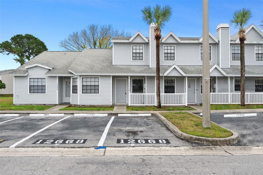 front view of a house with a garden