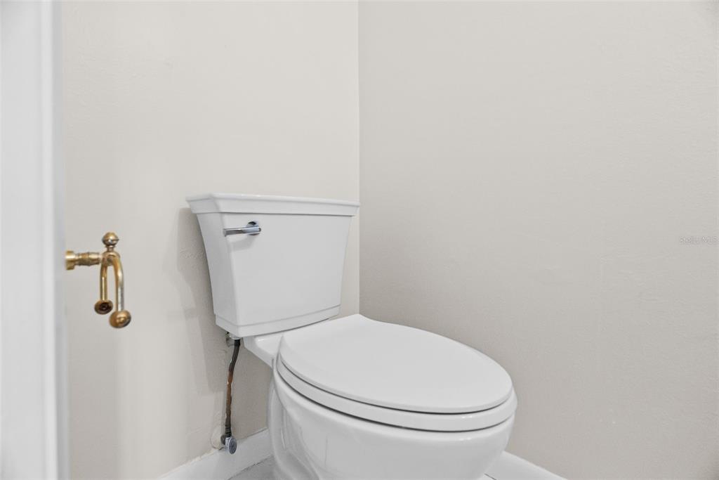 12668 Castle Hill Drive Tampa, FL 33624 - Photo 13 of 32 a white toilet sitting next to a shower