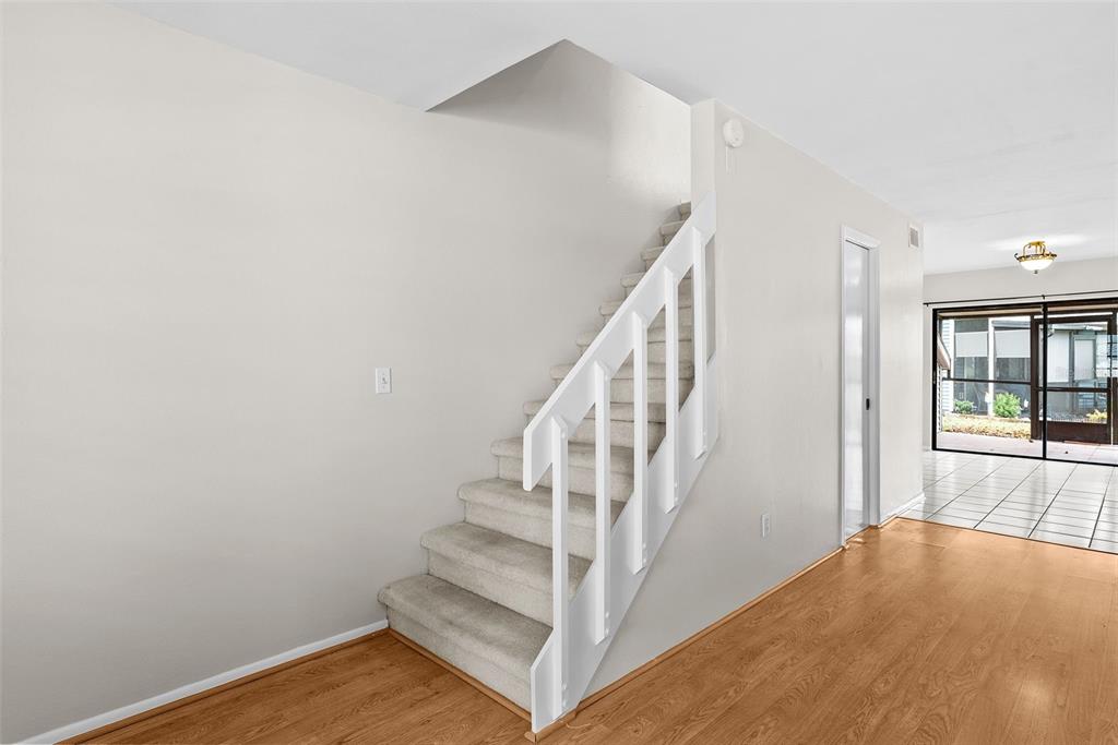 12668 Castle Hill Drive Tampa, FL 33624 - Photo 15 of 32 a view of entryway and hall with wooden floor
