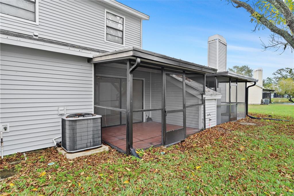 12668 Castle Hill Drive Tampa, FL 33624 - Photo 23 of 32 a backyard of a house with wooden fence