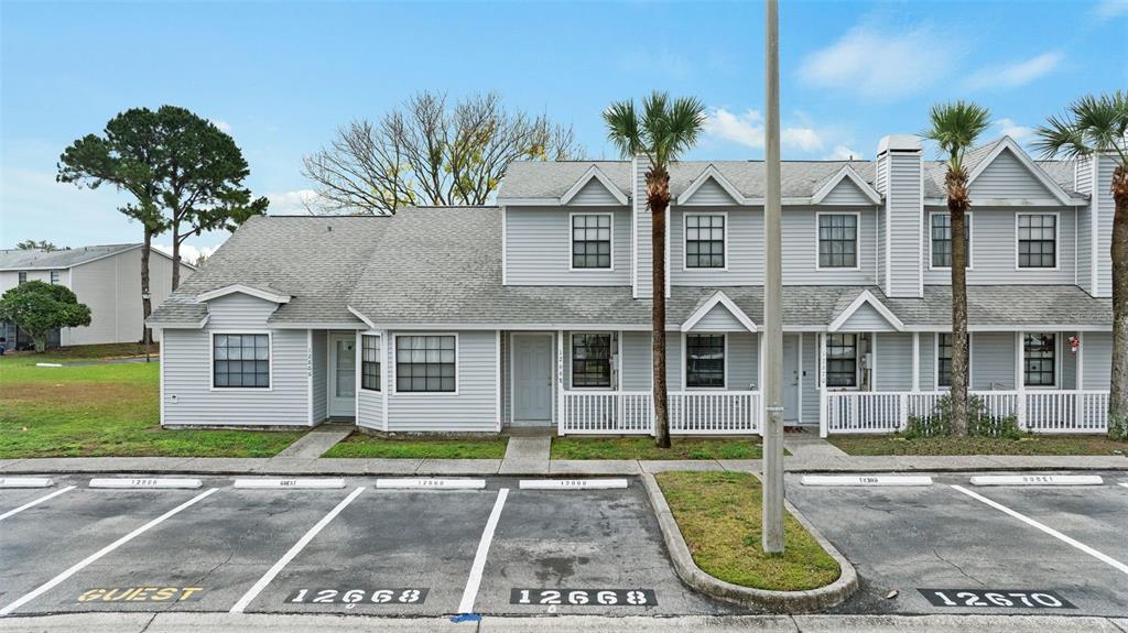12668 Castle Hill Drive Tampa, FL 33624 - Photo 26 of 32 front view of a house with a yard