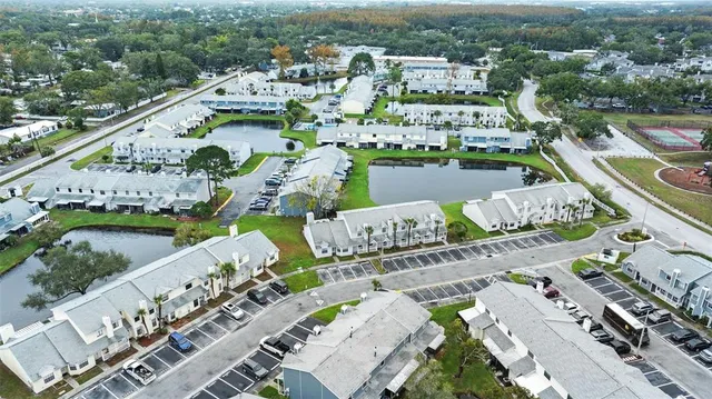 an aerial view of a city with lake view