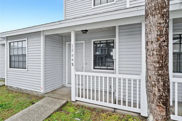 a front view of a house with a porch