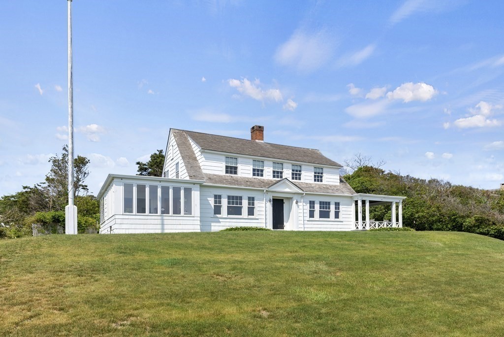160 Clark Road Bourne, MA 02562 - Photo 14 of 42 a front view of a house with a garden