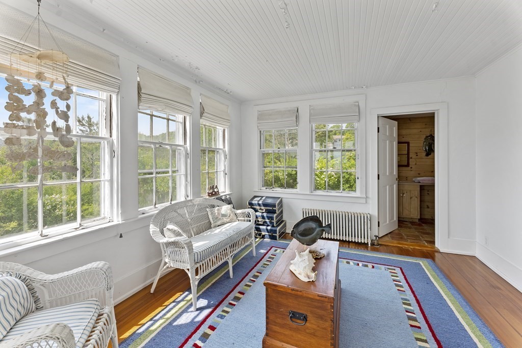 160 Clark Road Bourne, MA 02562 - Photo 18 of 42 a living room with furniture and a large window