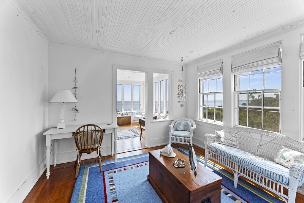 160 Clark Road Bourne, MA 02562 - Photo 19 of 42 a living room with furniture a rug and a large window