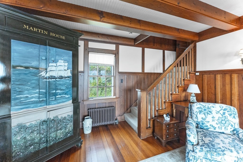 160 Clark Road Bourne, MA 02562 - Photo 21 of 42 a view of staircase with a large window and wooden floor
