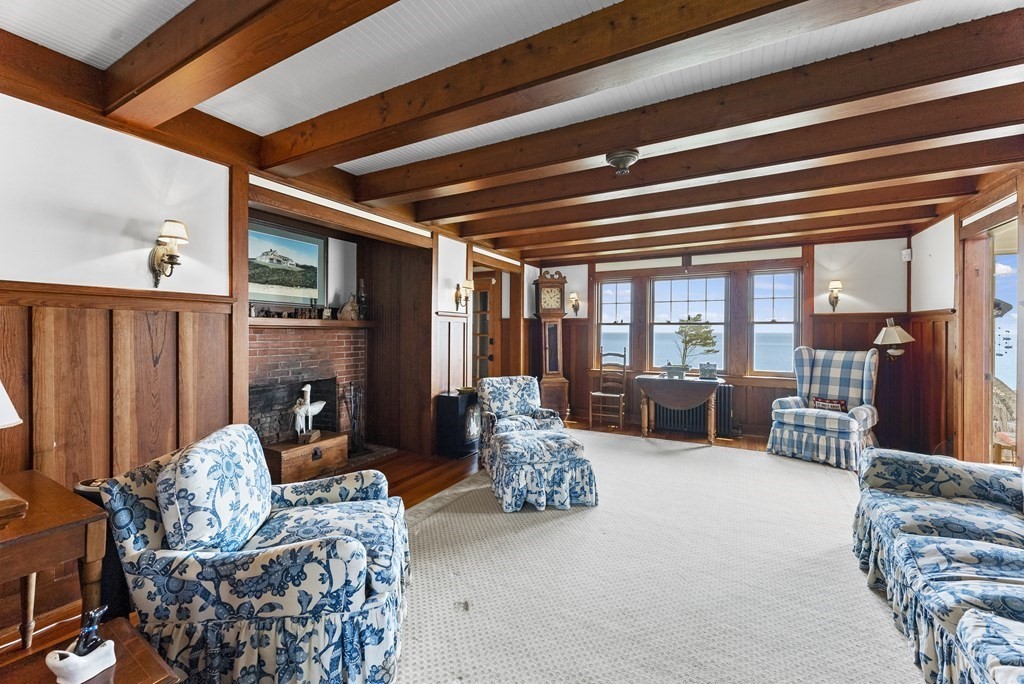 160 Clark Road Bourne, MA 02562 - Photo 22 of 42 a living room with furniture and a fireplace