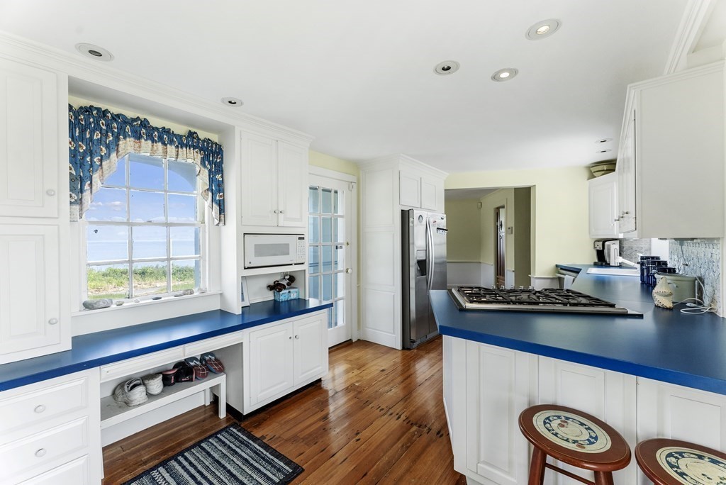 160 Clark Road Bourne, MA 02562 - Photo 32 of 42 a kitchen with stainless steel appliances a counter space and a window