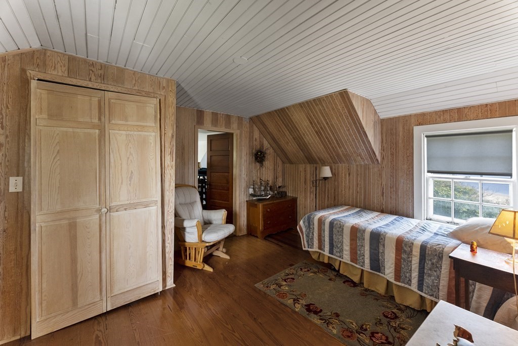 160 Clark Road Bourne, MA 02562 - Photo 41 of 42 a bedroom with bed and wooden floor