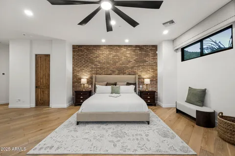 a bedroom with a large bed and a couch