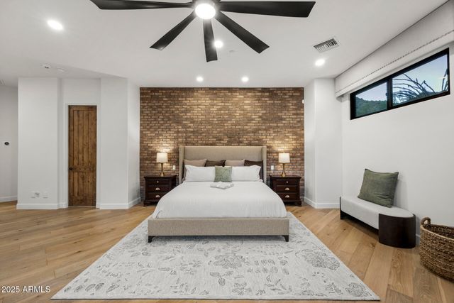 a bedroom with a large bed and a couch