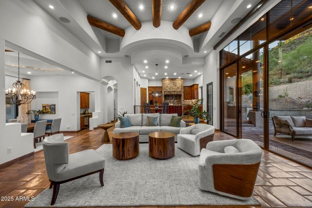 a large living room with furniture and a large window