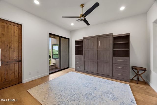 a view of an empty room with a cabinet