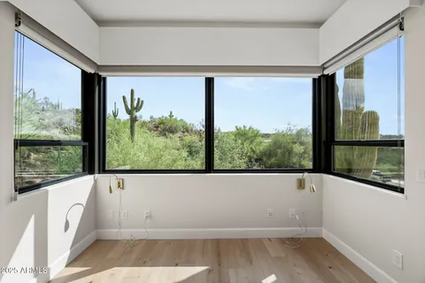 a view of a lot of a room with a large window