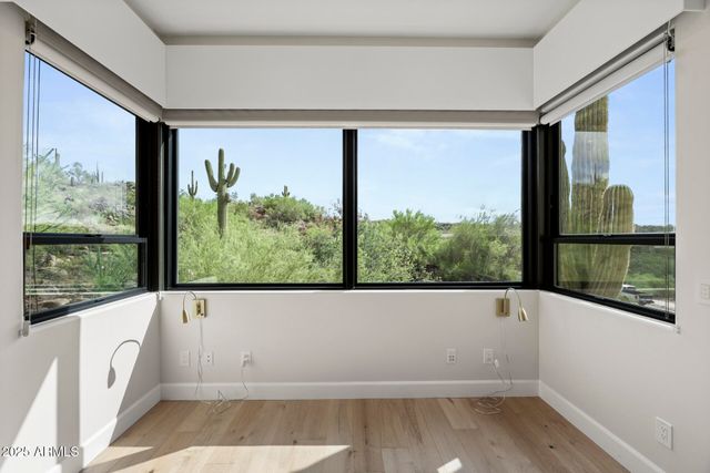 a view of a lot of a room with a large window