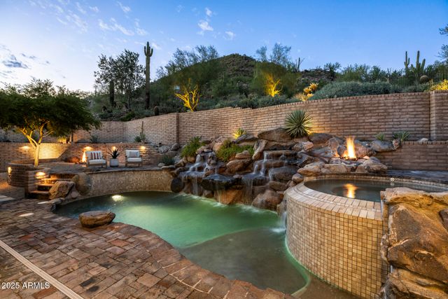 a view of swimming pool with outdoor seating