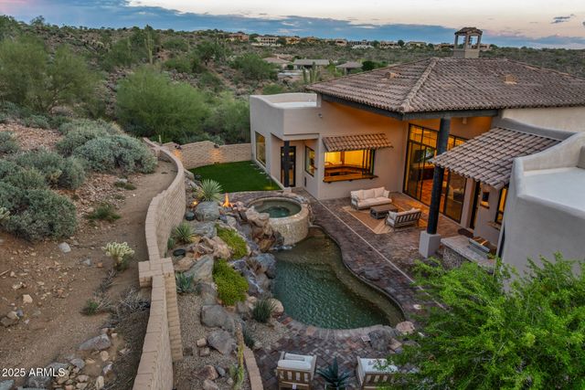an aerial view of a house with a big yard
