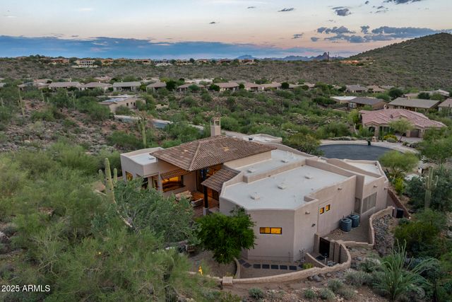 an aerial view of a house with a garden