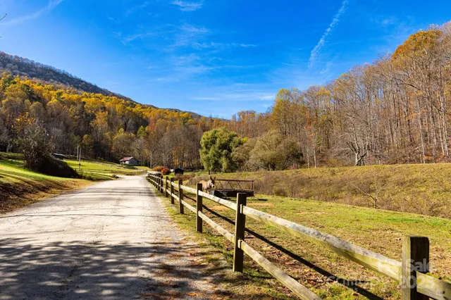 a view of outdoor space with wooden fence
