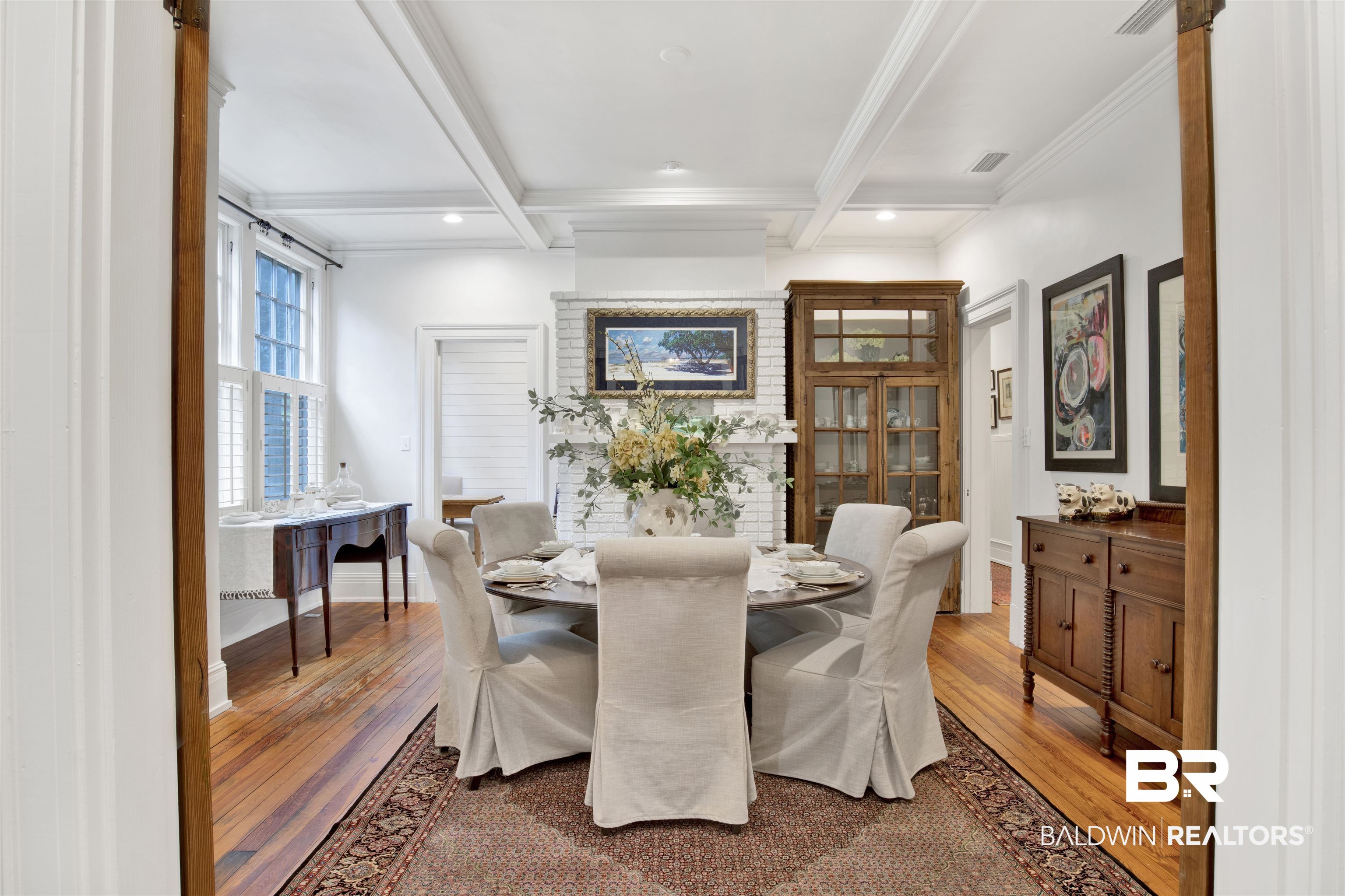 1654 Government Street Mobile, AL 36604 - Photo 22 of 45 Dining room with beam ceiling, wood-type flooring, crown molding, and coffered ceiling