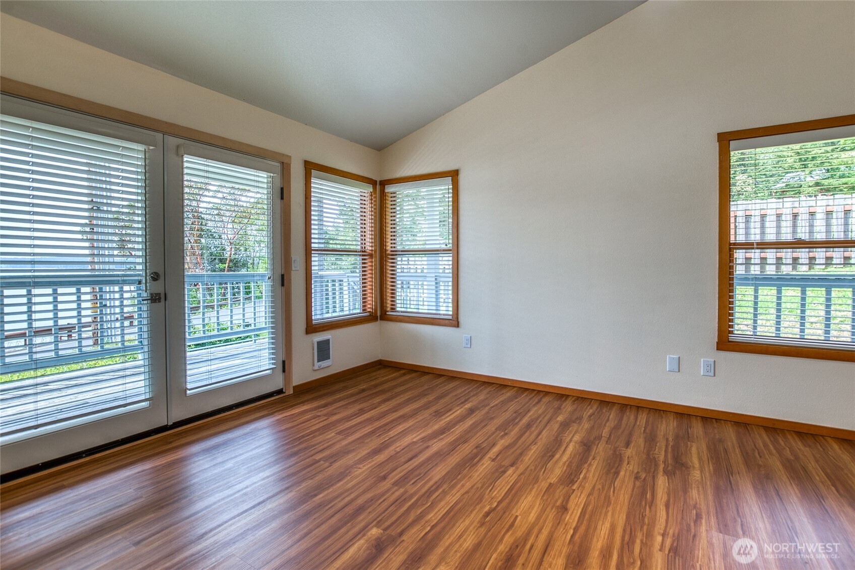 942 Deer Harbor Road Orcas Island, WA 98245 - Photo 5 of 40 a view of an empty room with wooden floor and a window