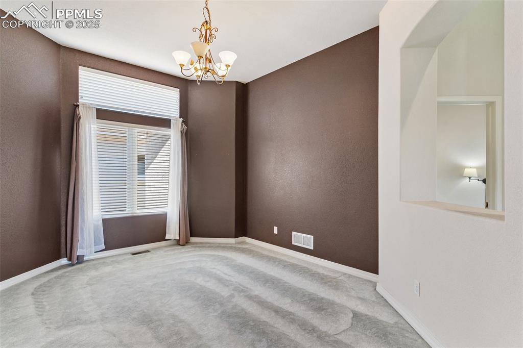 1680 Doe Run Point Colorado Springs, CO 80919 - Photo 11 of 42 Large open dining room off living room and entry