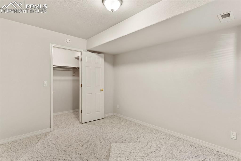 1680 Doe Run Point Colorado Springs, CO 80919 - Photo 24 of 42 Bedroom in lower level with spacious closet