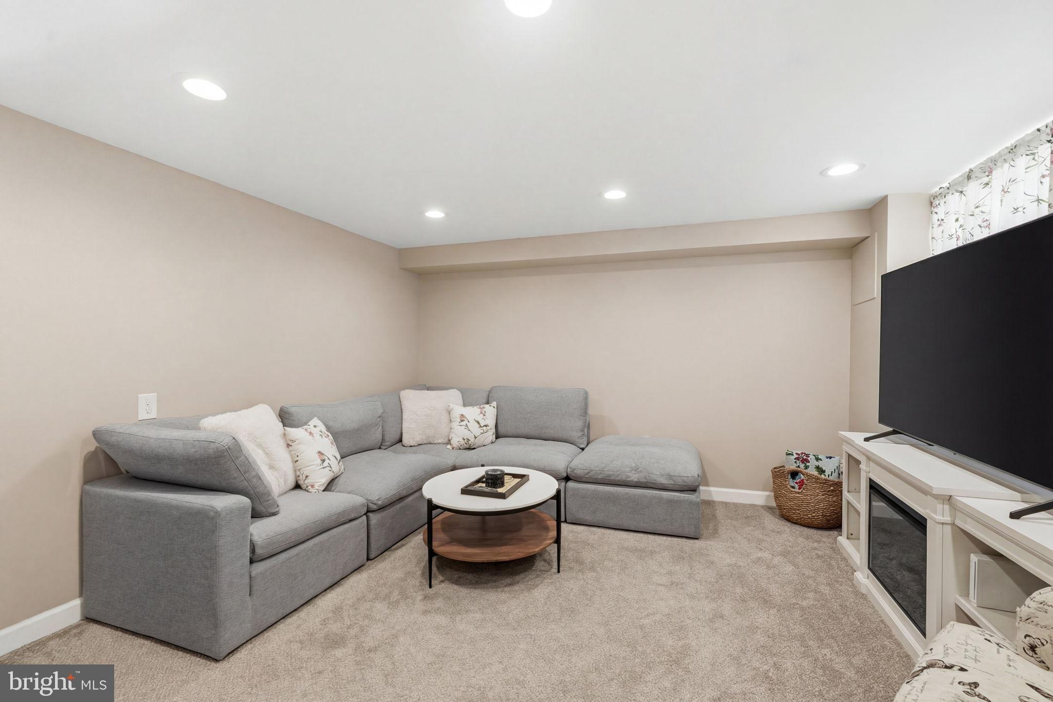 3252 Fordham Road Philadelphia, PA 19114 - Photo 24 of 29 a living room with furniture and a flat screen tv
