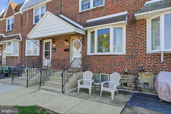a view of a patio with table and chairs and wooden floor