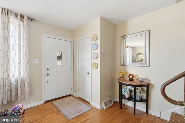 a view of an entryway with wooden floor