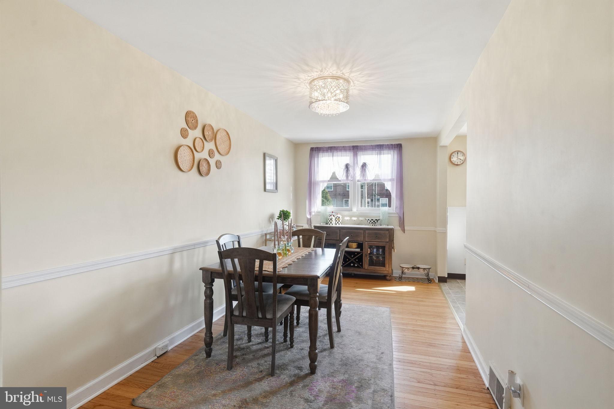 3252 Fordham Road Philadelphia, PA 19114 - Photo 10 of 29 a view of a dining room with furniture and a chandelier