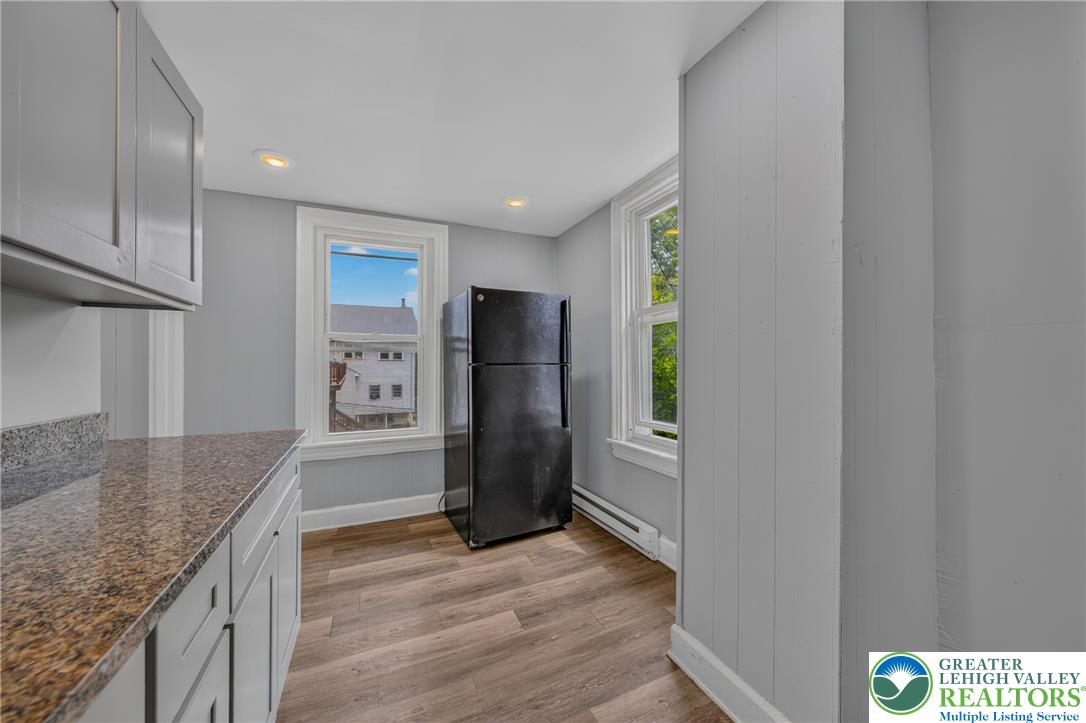 313 Main Street Slatington, PA 18080 - Photo 55 of 73 Functional kitchen with ample counter space and storage cabinetry, illuminated by recessed lighting and natural window light.