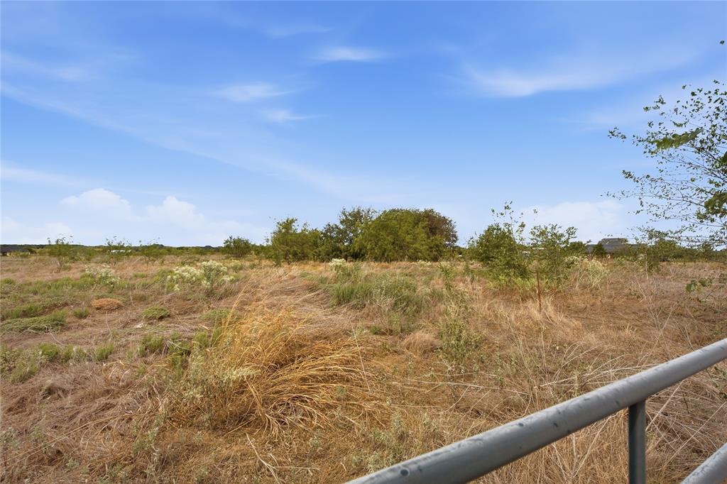 0 Northeast CR 1060 Rice, TX 75155 - Photo 13 of 30 Expansive land with natural vegetation and mature trees, featuring a metal railing