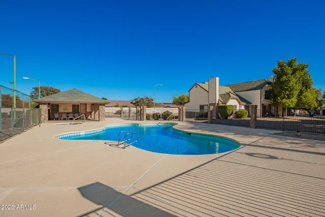 a view of a house with swimming pool