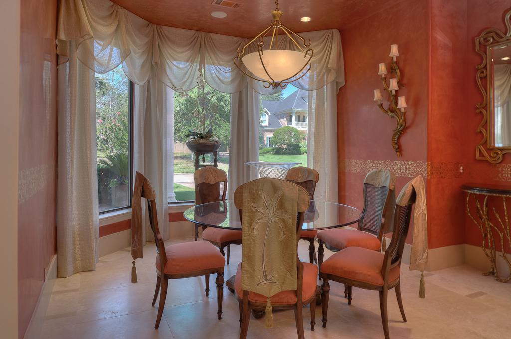 265 Promenade Street South Montgomery, TX 77356 - Photo 11 of 45 a dining room with furniture a chandelier and wooden floor