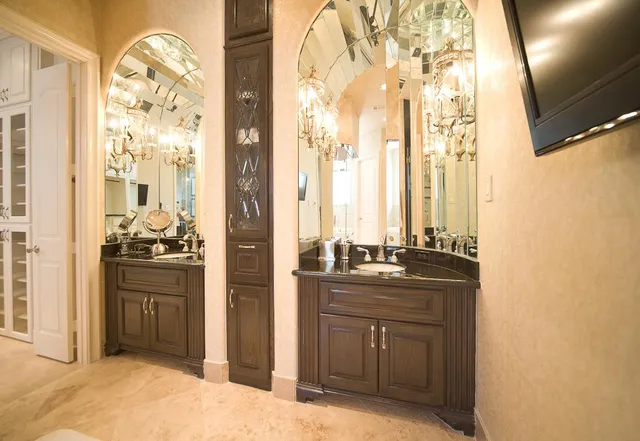 a kitchen with stainless steel appliances granite countertop a sink and a refrigerator
