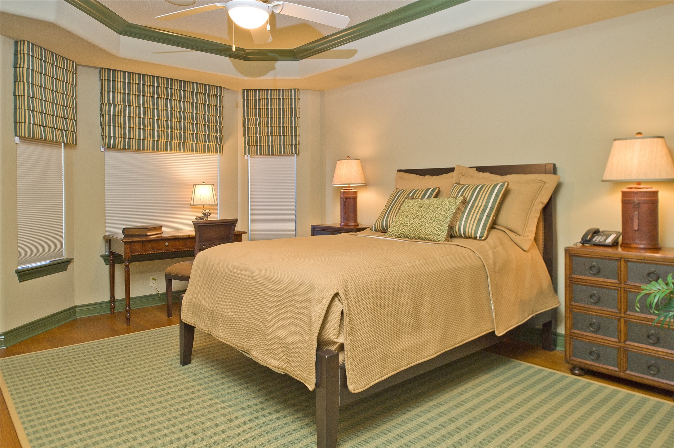 265 Promenade Street South Montgomery, TX 77356 - Photo 36 of 45 a bed sitting in a bedroom next to a window and a chandelier