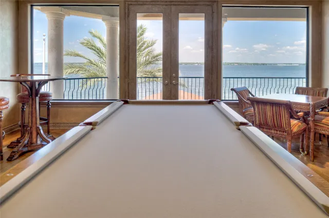 a couch sitting in a bedroom next to a lamp