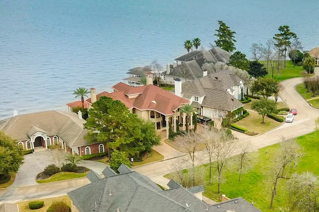 an aerial view of a house with a swimming pool