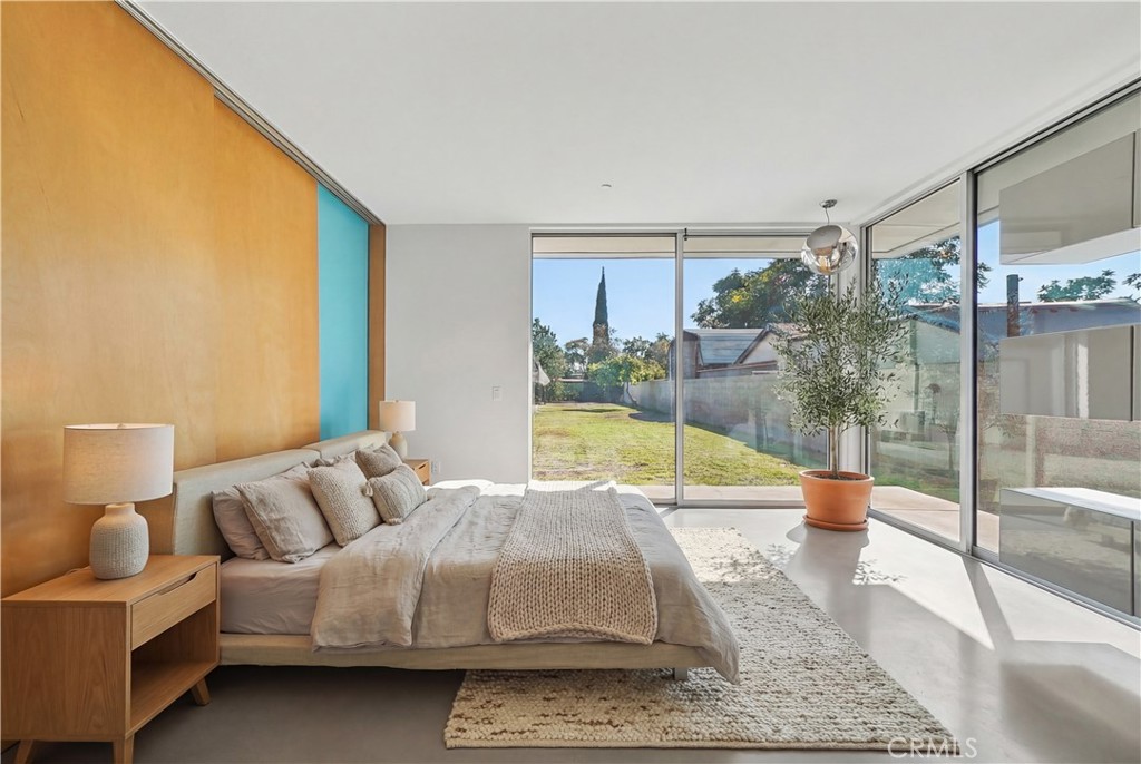 12066 Celine Street El Monte, CA 91732 - Photo 12 of 21 a living room with furniture and a floor to ceiling window