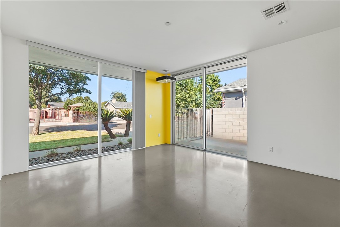 12066 Celine Street El Monte, CA 91732 - Photo 14 of 21 an empty room with large windows and view of the floor