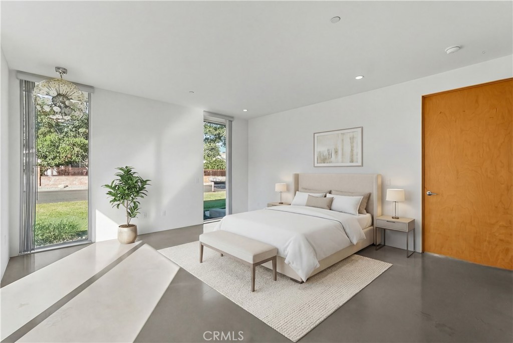 12066 Celine Street El Monte, CA 91732 - Photo 16 of 21 a bedroom with a large bed and a potted plant