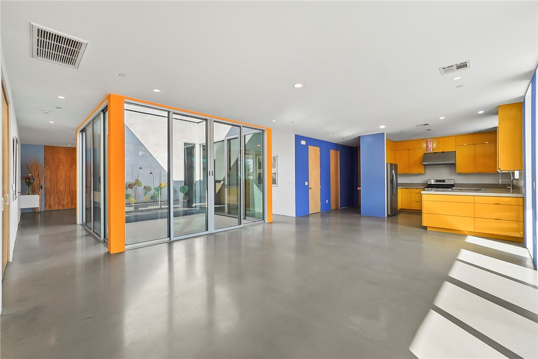 12066 Celine Street El Monte, CA 91732 - Photo 7 of 21 a view of an empty room with window and wooden floor